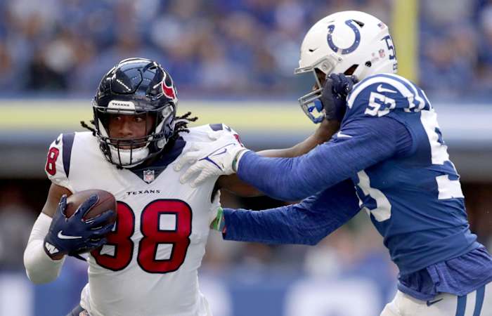 Indianapolis Colts outside linebacker Darius Leonard (53) works to bring down Houston Texans tight end Jordan Akins (88) as he rushes the ball Sunday, Oct. 17, 2021, during a game against the Houston Texans at Lucas Oil Stadium in Indianapolis.